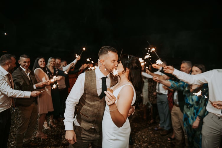 An arch of sparklers, Nerys and Simon