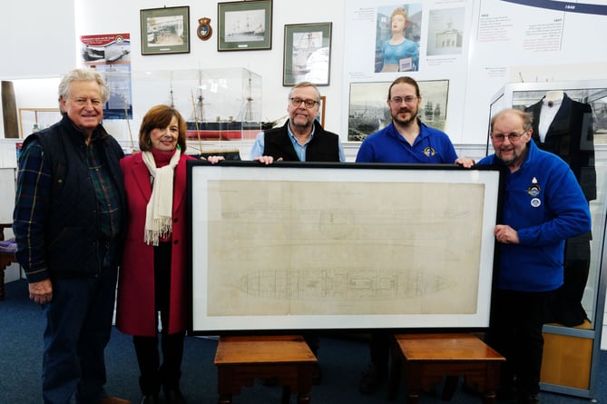 Ian and Christine Jacob hand over the Warrior engraving to Pembroke Dock Heritage Centre team members Trevor Clark, David Howell and John Evans.

PICTURE: Martin Cavaney Photography