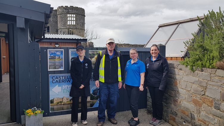 Peter Kraus with staff at the Nest Café at Carew Castle, the mid-point of his 15.6-mile walking challenge for veterans charity Combat Stress.