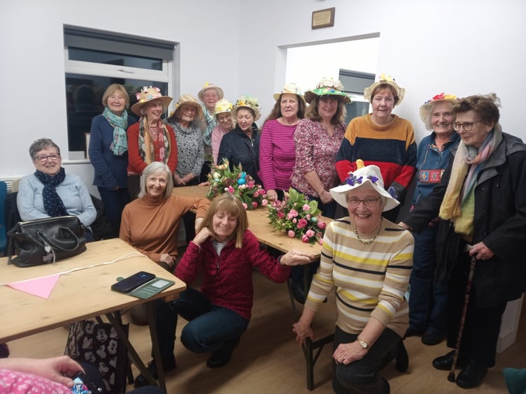 Hundleton WI members - wearing their Easter Bonnets - with guests for the evening.