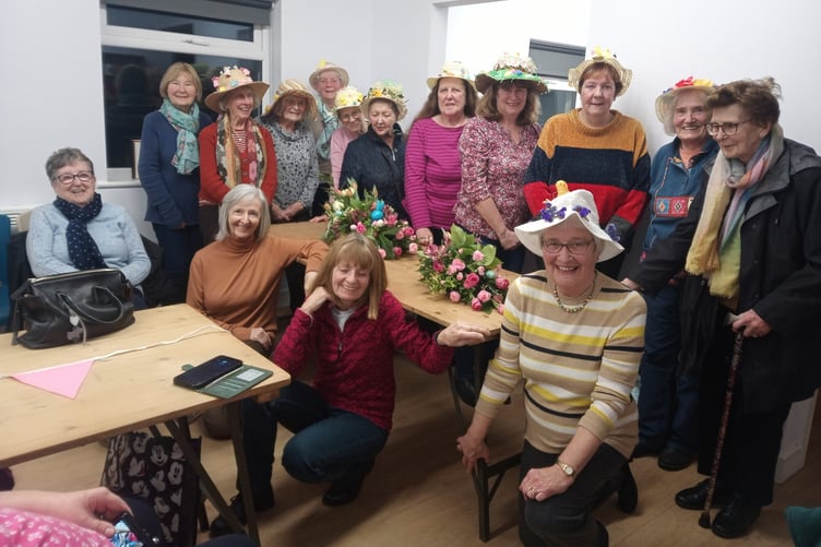 Hundleton WI members - wearing their Easter Bonnets - with guests for the evening.