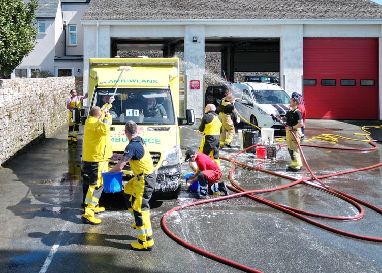 Firefighters from the on-call fire crew at Tenby Fire Station and Tenby RNLI Station, made the most of the hot, sunny weather over the weekend with a fundraising car wash to raise money for the RNLI. The fire station, based in the heart of the hugely popular seaside resort of Tenby, Pembrokeshire, is well known for the fundraising activities they do. The car wash also attracted fellow emergency service, The Welsh Ambulance.
