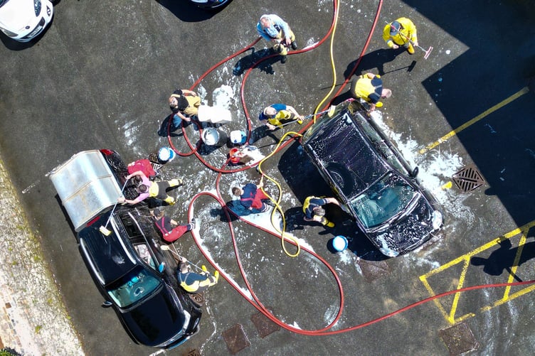 Firefighters from the on-call fire crew at Tenby Fire Station and Tenby RNLI Station, made the most of the hot, sunny weather over the weekend with a fundraising car wash to raise money for the RNLI. The fire station, based in the heart of the hugely popular seaside resort of Tenby, Pembrokeshire, is well known for the fundraising activities they do. The car wash also attracted fellow emergency service, The Welsh Ambulance.