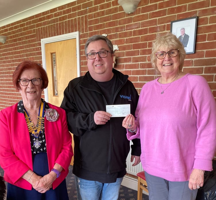 Drew Baker of The Vision Theatre Company accepting a donation from Dot Edwards and President of Inner Wheel of Pembroke June Willcocks