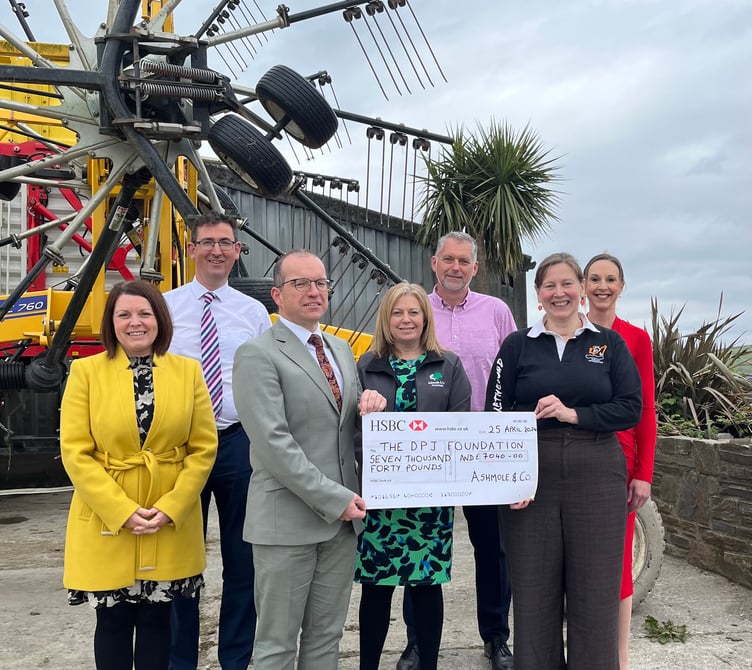 Ashmole & Co Partners handing over a cheque for £7,040 to Kate Miles, Manager of the DPJ Foundation