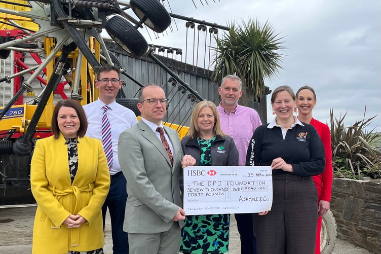 Ashmole & Co Partners handing over a cheque for £7,040 to Kate Miles, Manager of the DPJ Foundation