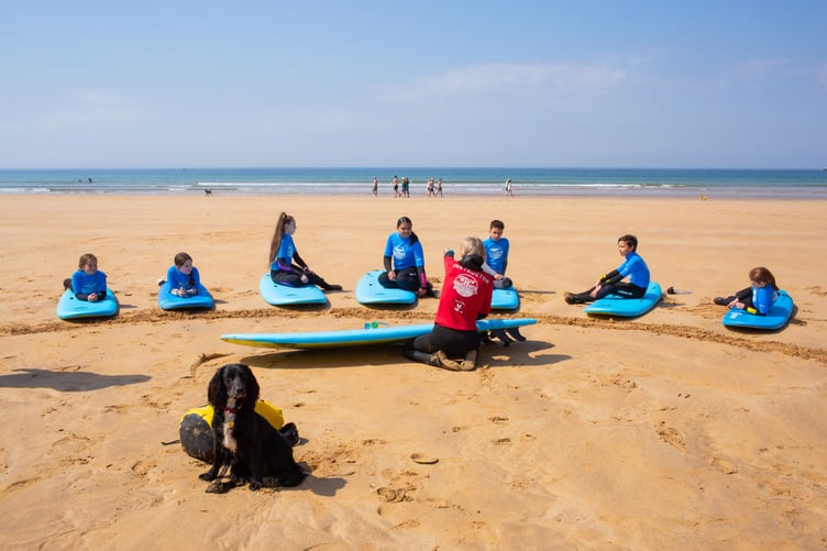 Ariel on the beach with the surf club