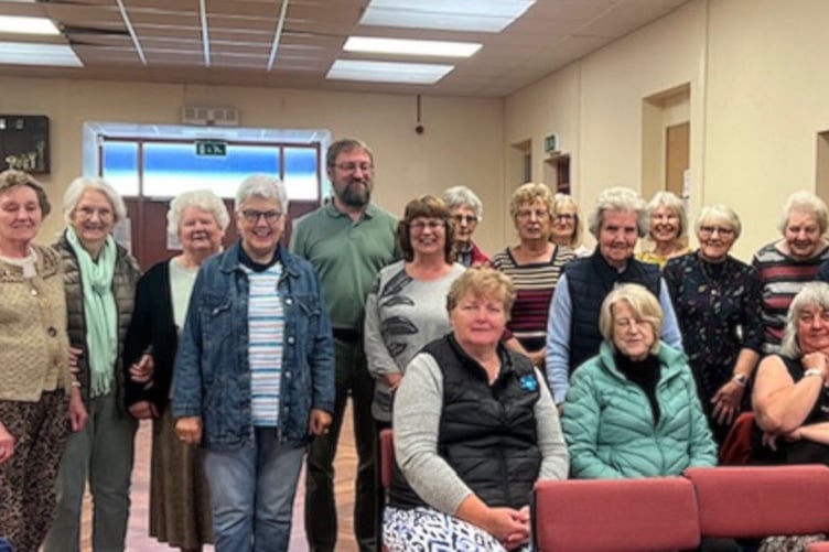 Reporter Patrick Ovenden with WI members at Carew Memorial Hall