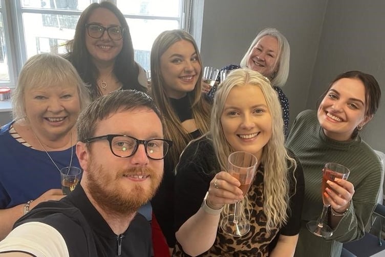 Roz and the team from the Tenby branch celebrate
