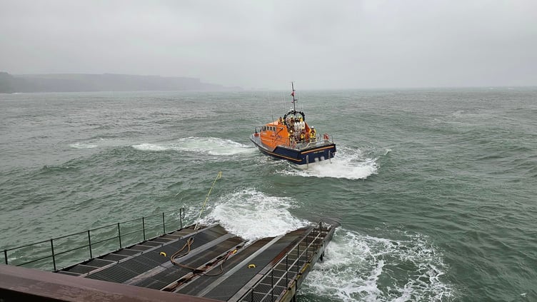Tenby RNLI Lifeboat launches into the rough sea remnants of Hurricane Ernesto