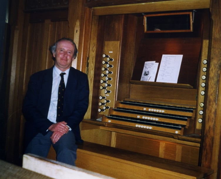 The late Musical Director of St Mary’s Church, Tenby, Dr John Harrison, at the organ