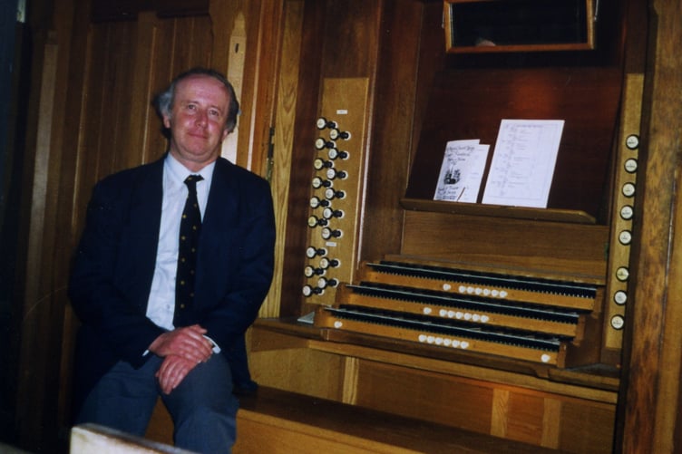 The late Musical Director of St Mary’s Church, Tenby, Dr John Harrison, at the organ