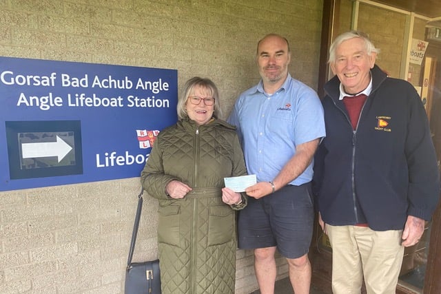 Keith and Dee Williams (Lawrenny Yacht Club and Water Users) presenting a cheque for £240 to Angle Lifeboat at their new base in Milford Haven. The money was raised in a raffle at a recent barbecue at the Lawrenny Arms.