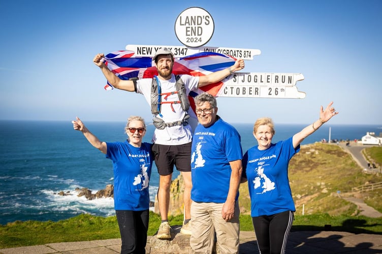 Adam Jovic at Lands End finish with family members