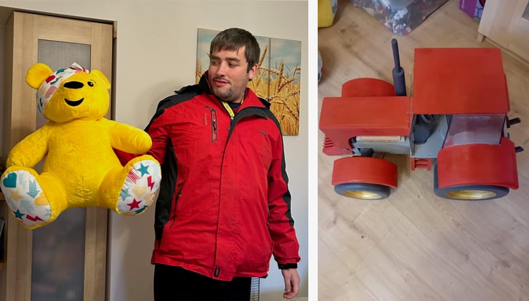 George MacCreath with Pudsey and the hand-crafted wooden tractor