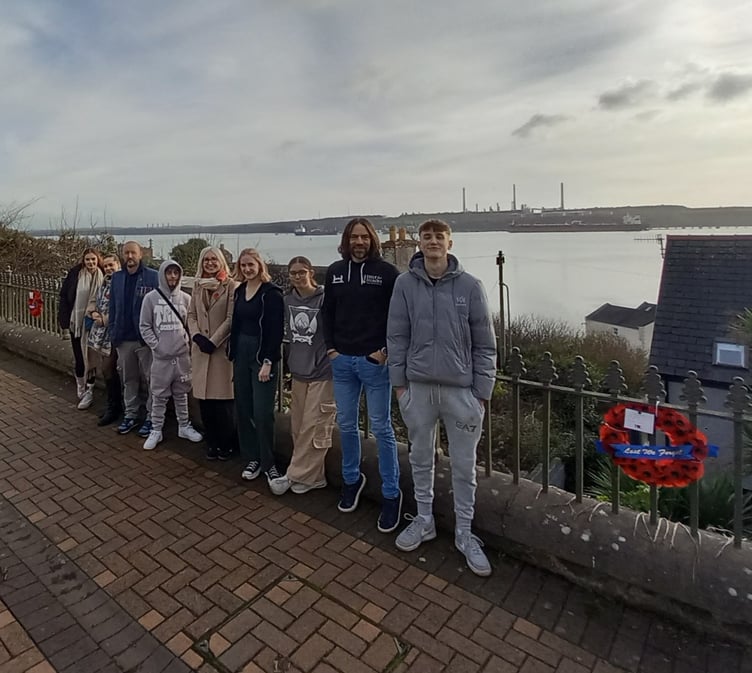 Young people have created a Poppy Walk along Hamilton Terrace in Milford Haven. Alfie, Kaden, Lily, Megan and Jenna are pictured with staff from Pembrokeshire Youth Service and Futureworks.