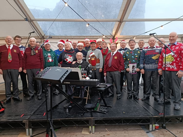 Pembroke and District Male Voice Choir brought seasonal cheer to Pembroke Castle’s Christmas Fayre, sporting a fine selection of Christmas sweaters, ties and Santa hats, accompanied by Rev’d William Lambert, who recently joined the ranks.