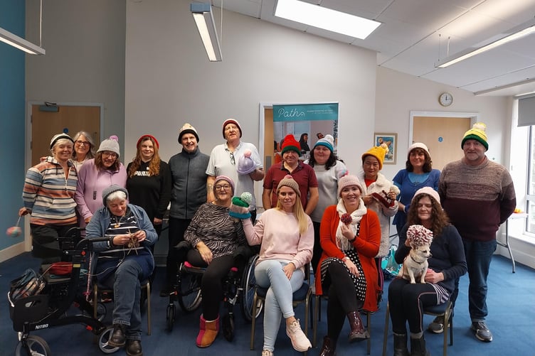 PATH Numeracy Project learners and tutors sporting the donated hats - with added bobbles!