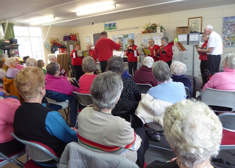 Tenby Friendship Club enjoying a performance of St Mary's Bell Ringers at Augustus Place Community Hall