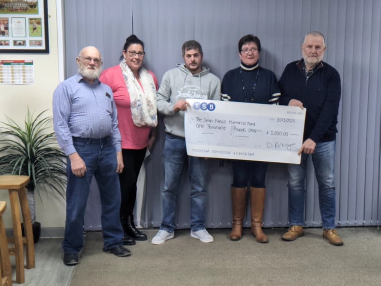 Whitland Classic Motor Club chairman Richard Husband, secretary Xoe Meadows and treasurer David Armytage present the cheque to Gwenfair and Alun Mason. Dean Mason Memorial Fund, Cardiac Risk in the Young (CRY) charity.