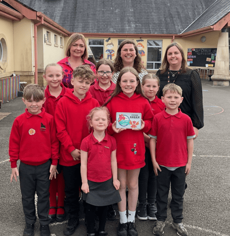 Pembrokeshire Local Authority's Catrin Phillips  visited Narberth Community Primary School on Wednesday to present an award for achieving silver status in the Siarter Iaith. She is pictured here with Headteacher Mrs Kate Moore, Criw Cymraeg leaders Chloe Ormond and Meinir Lloyd and pupils in the Welsh and English streams.
