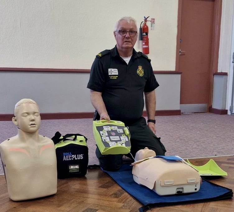 Tony Wall demonstrating CPR at the Carew WI meeting