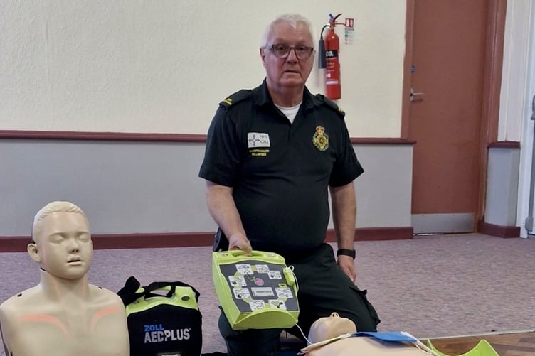 Tony Wall demonstrating CPR at the Carew WI meeting