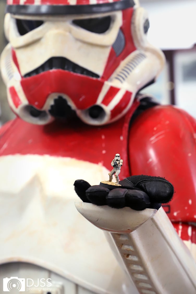 Mini Storm Trooper held by Storm Trooper re-enactor