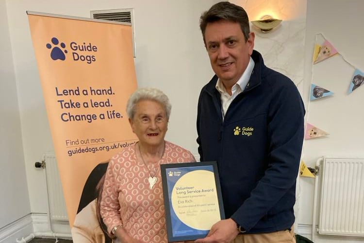 Eva Rich receives her certificate from Guide Dogs’ chief executive, Andrew Lennox