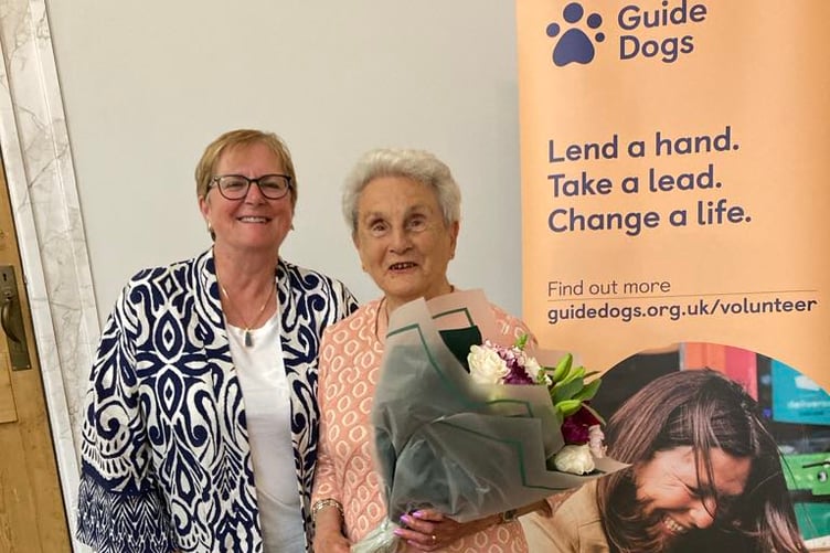 Pembrokeshire volunteer Lynn Knibbs with Lifetime of Service award winner Eva Rich, who is holding a bouquet.