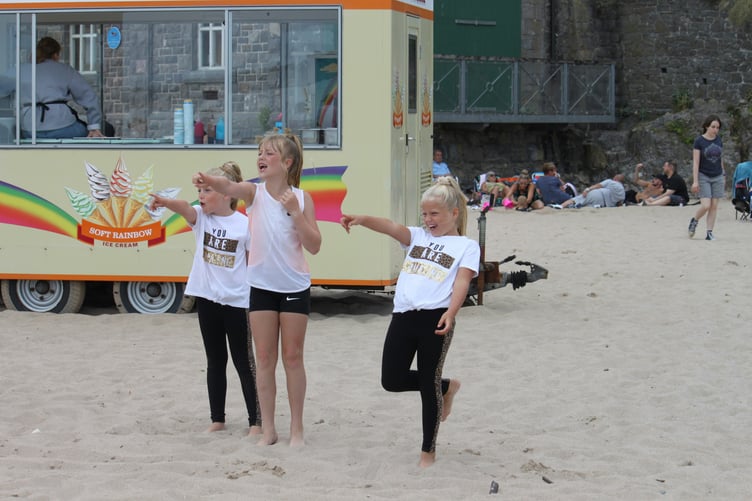 Stock image of children on Tenby’s Castle Sands