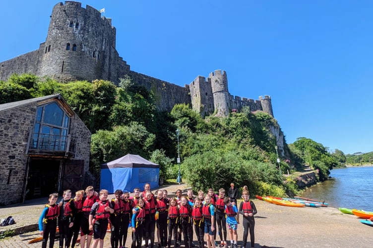 Paddle West students in front of Pembroke Castle