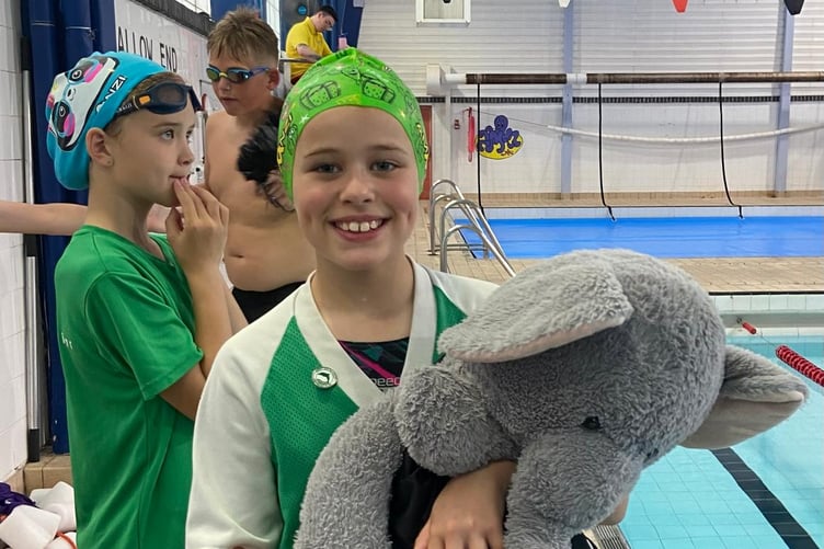 Swimmer with soft toy elephant at Tenby Dolphins 50th gala
