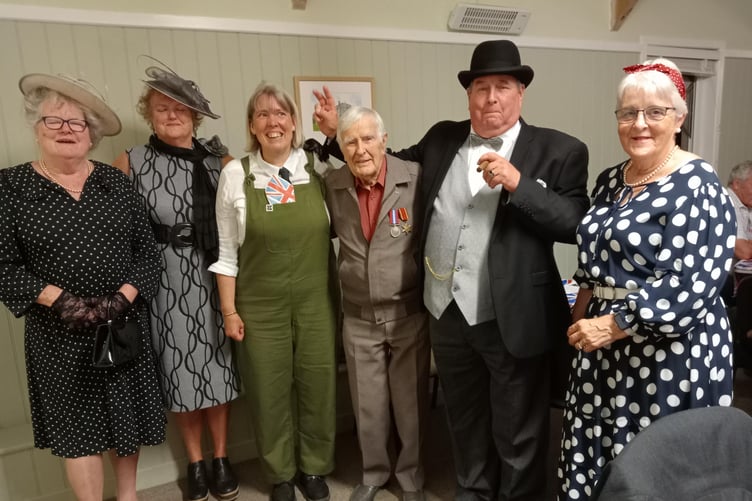Joining ‘Mr and Mrs Churchill’ – Richard and Carol Johns – at The Rhos VJ-Day party were, left to right: Pam Shepherd, Christine Akers, Sue Jones and wartime Veteran Duncan Hilling.