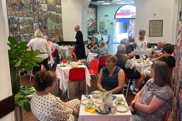 Dressed in Victorian style, Guild Ladies served guests hot drinks and lemonade and sold homemade donated cakes.
