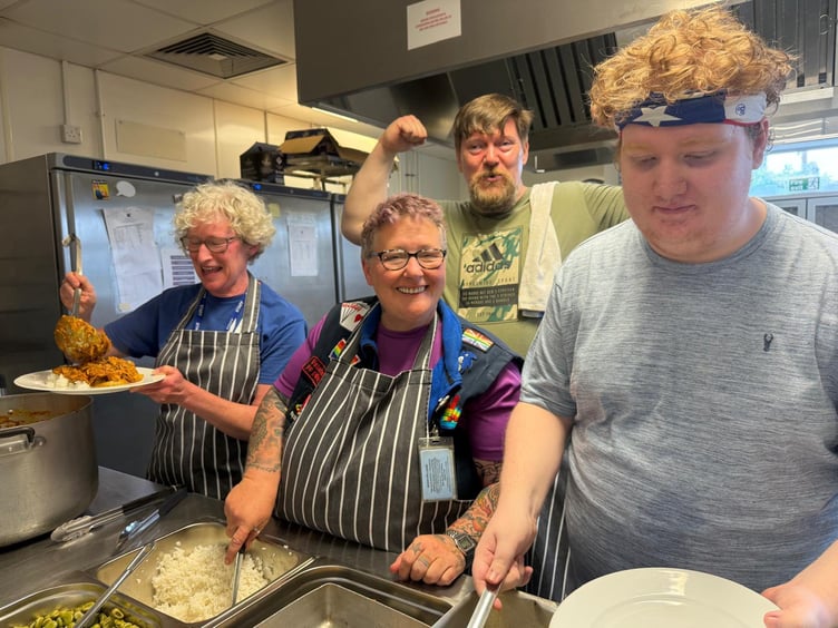 The VC Gallery kitchen volunteers serving the community meal