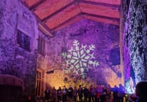 Local choirs to bring Christmas cheer to Carew Castle’s Glow event