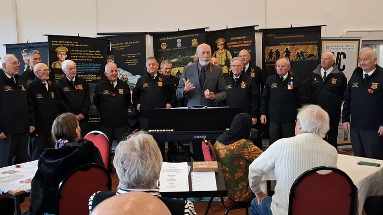 Choir accompanist Rev’d William Lambert and choristers at the VC Gallery