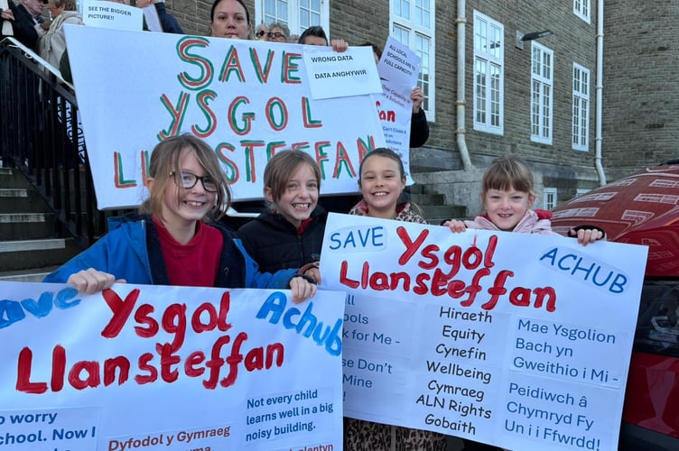 young protesters worried about the future of Ysgol Llansteffan on the steps of County Hall, Carmarthen (pic courtesy of Cymdeithas yr Iaith and free for use for wire partners) 