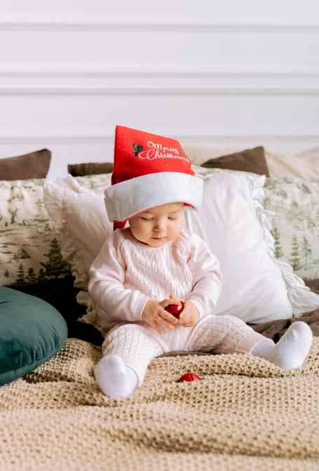 Baby on bed - Christmas