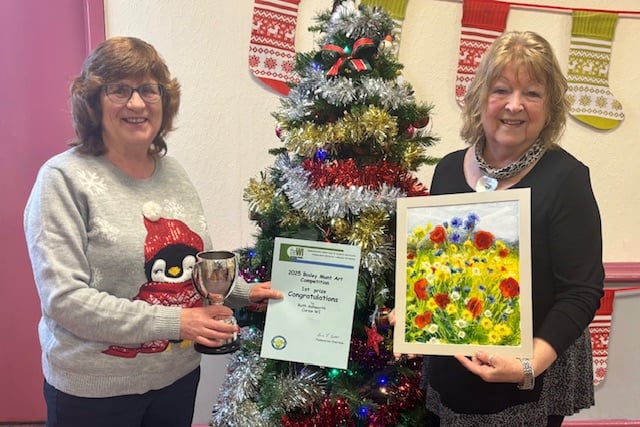 Carew WI President Edith congratulates Ruth Ashworth on winning the Bisley Munt Cup
