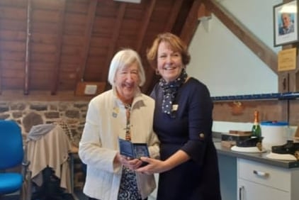 Doreen Mortimer receiving the award from Jayne George