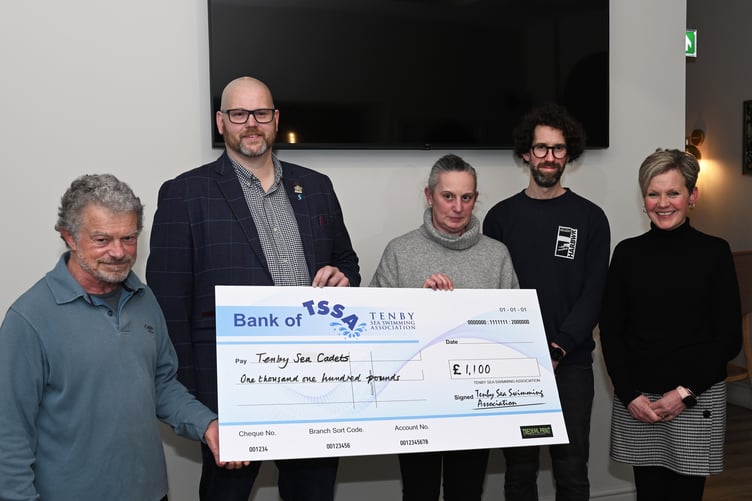 Mayor Dai Morgan receives the Tenby Sea Cadets cheque. Also pictured is Richard Johnson, brewery manager for the event's main sponsor, Harbwr Brewery.