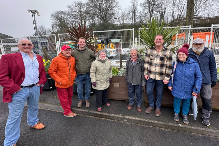 Members of the late Des Brown’s family are pictured with the planter at Tenby Railway Station with Civic Society members and former Greenhill teacher Mark Lewis.