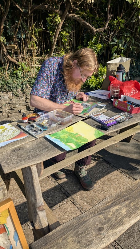 Artist in Residence Dan Ray Everett at work in the garden at Manorbier Castle Inn