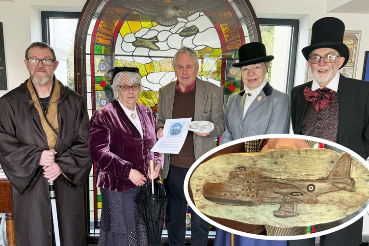 John Rattenbury with the mystery money box and Heritage Centre volunteers.