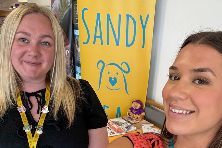 Georgia and Sadie manning the Sandy Bear table at Morriston Hospital, Swansea