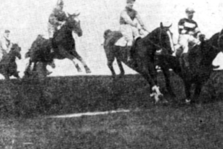 Clearing the water jump at a Tenby race meeting in the 1920s