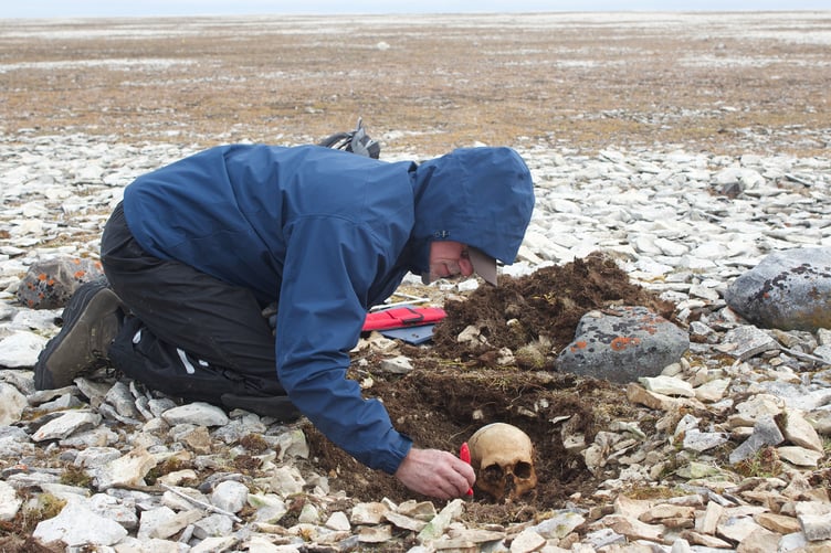 Dr Douglas Stenton, Anthropologist and Adjunct Assistant Professor at the University of Waterloo,
excavating the bones of Franklin sailors at Erebus Bay