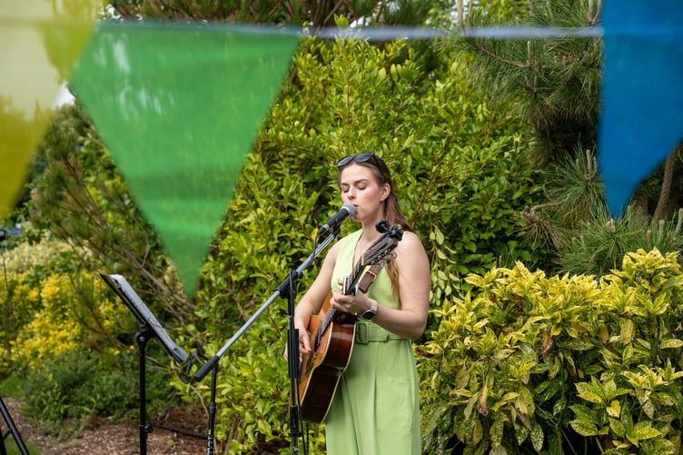 Pembrokeshire musician Rosey Cale providing the soundtrack to the 10th Anniversary celebration at Twr y Felin, St Davids
